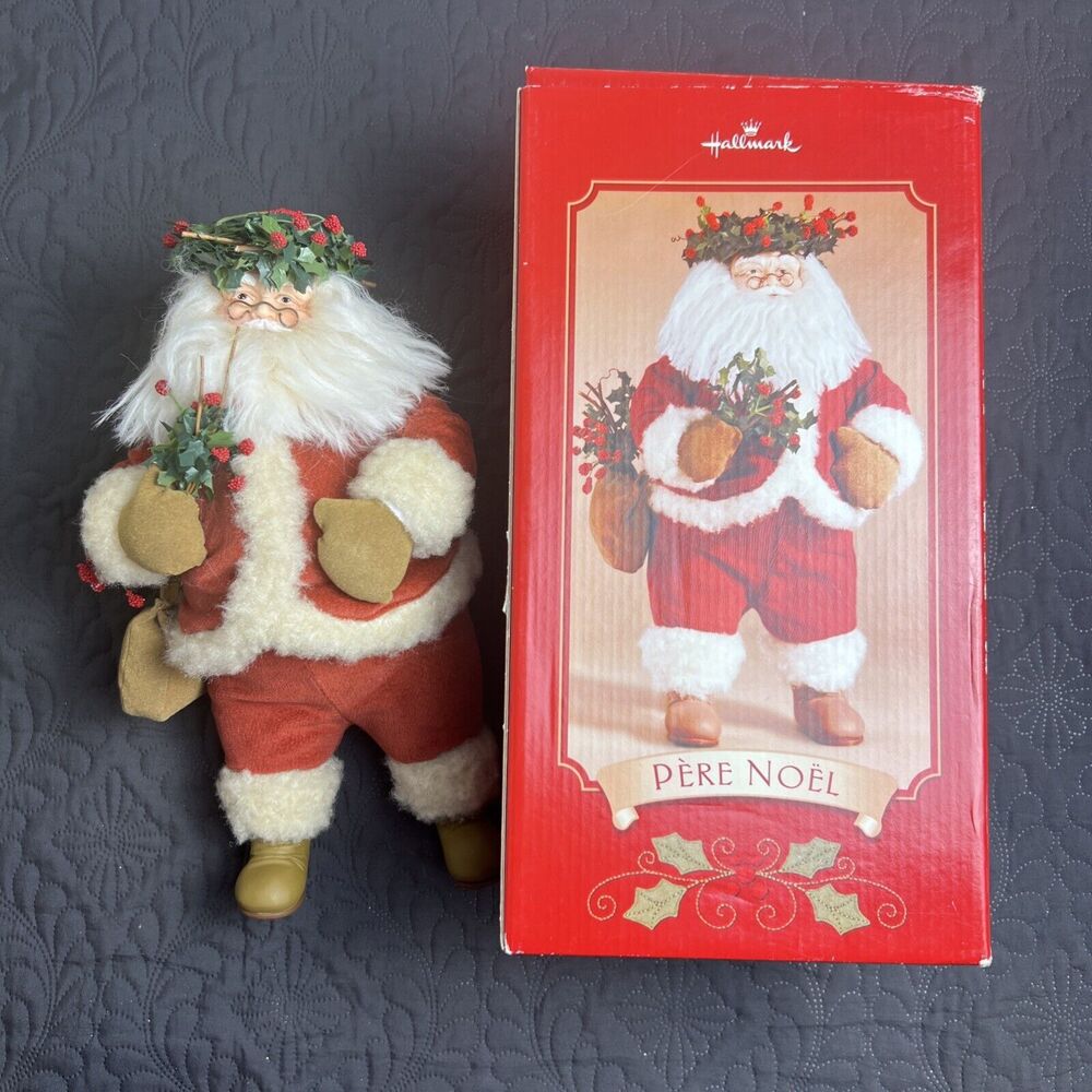 Hallmark 12.5" tall standing Pere Noel Santa wearing a holly wreath boxed USED